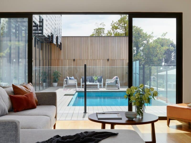 brown sofa near glass window
