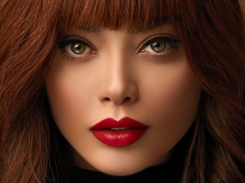 woman with red hair and black lipstick
