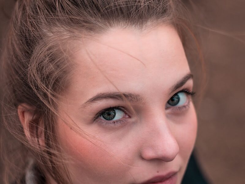 shallow focus photo of woman face
